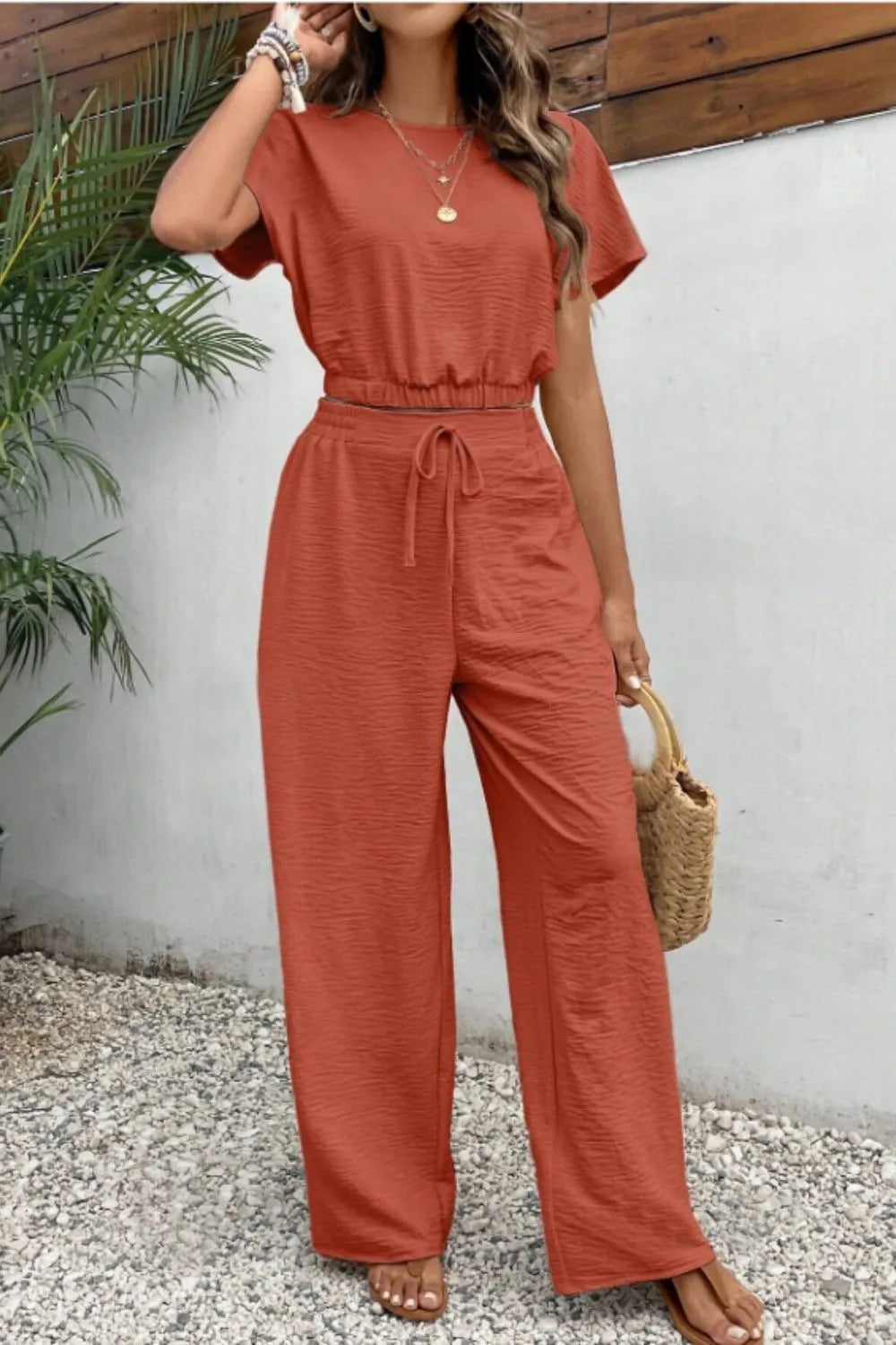 Women's solid color round neck slim fit sleeveless top and pants set