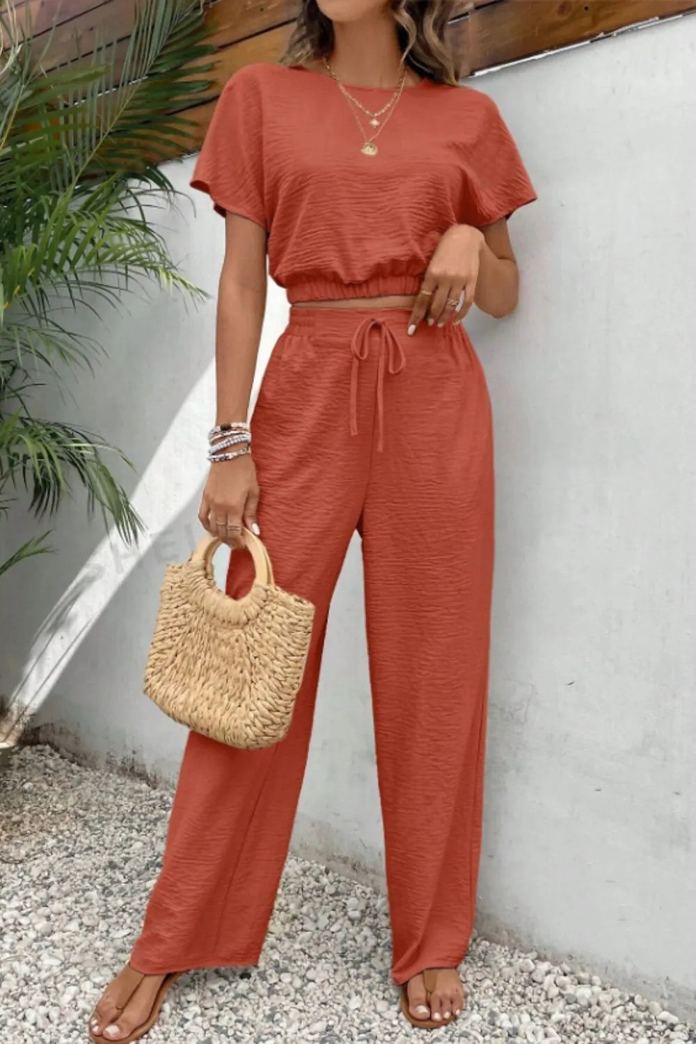 Women's solid color round neck slim fit sleeveless top and pants set